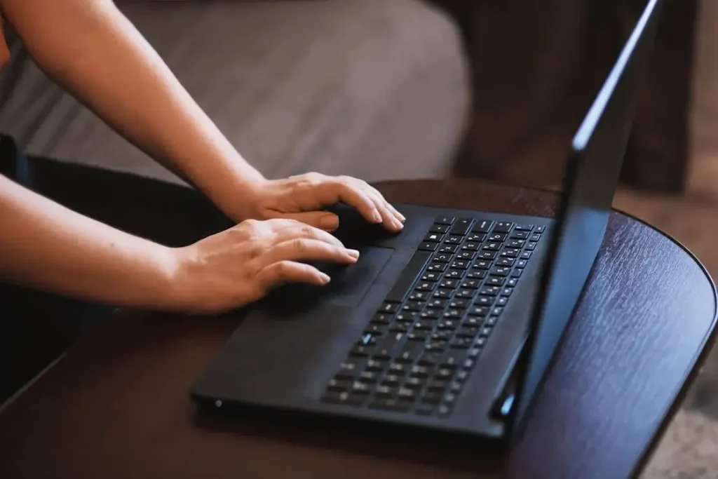 A person searching for Instagram comments on a laptop.